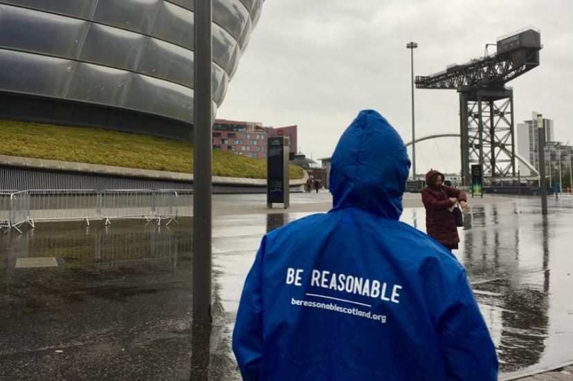 A Be Reasonable volunteer stands outside the SECC Glasgow.